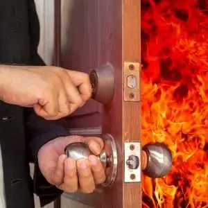 abstract business man will close the door for shut fire burn