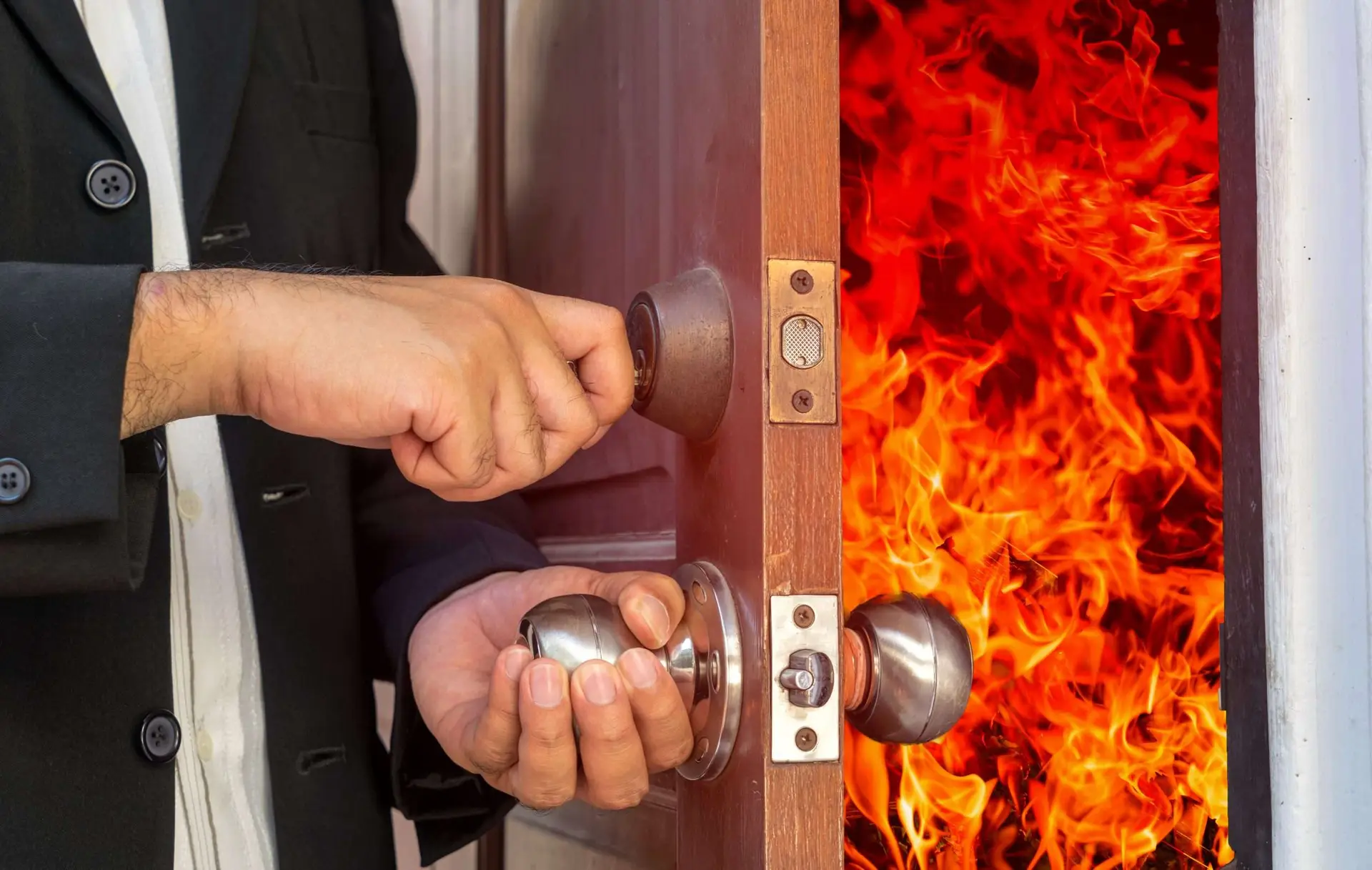 abstract business man will close the door for shut fire burn