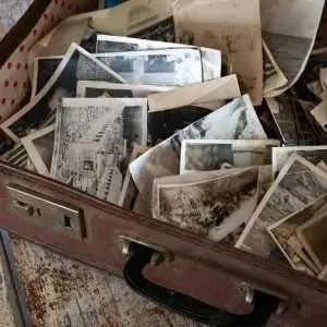 A suitcase filled with old photos.