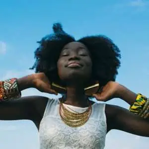 A black woman feeling a lovely and happy mood.