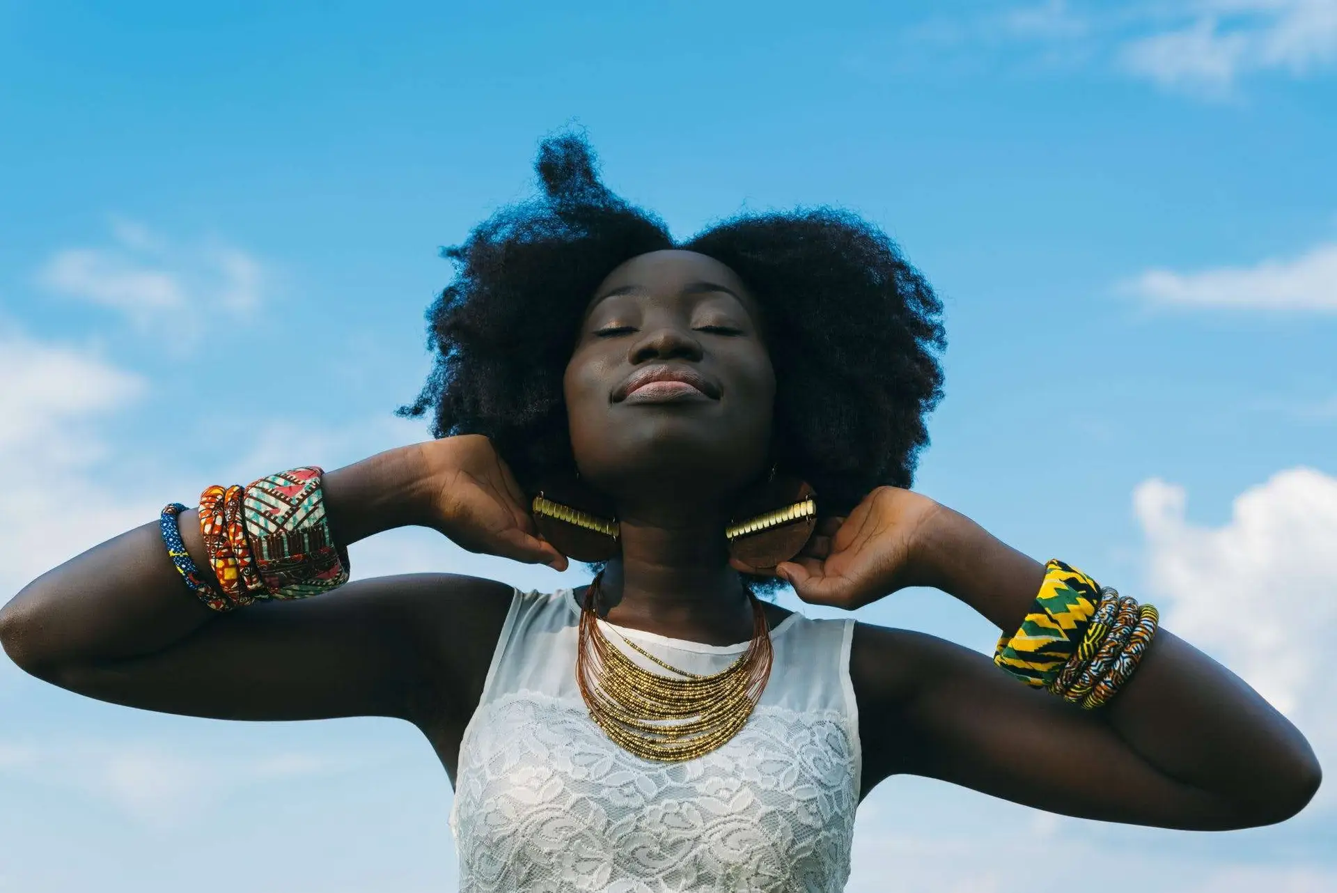 A black woman feeling a lovely and happy mood.