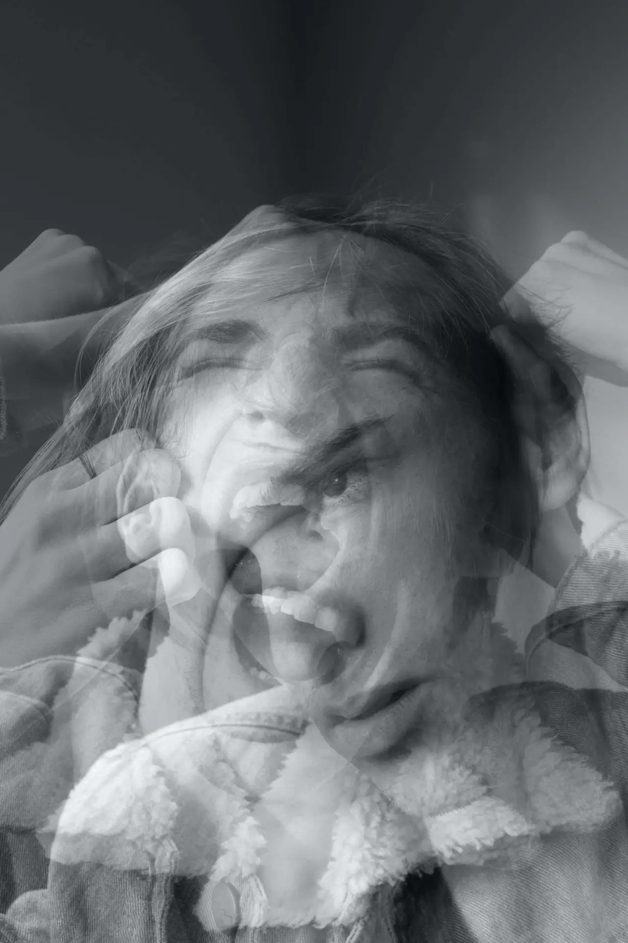 Creative photo of a person having many emotions with blurry head motion.